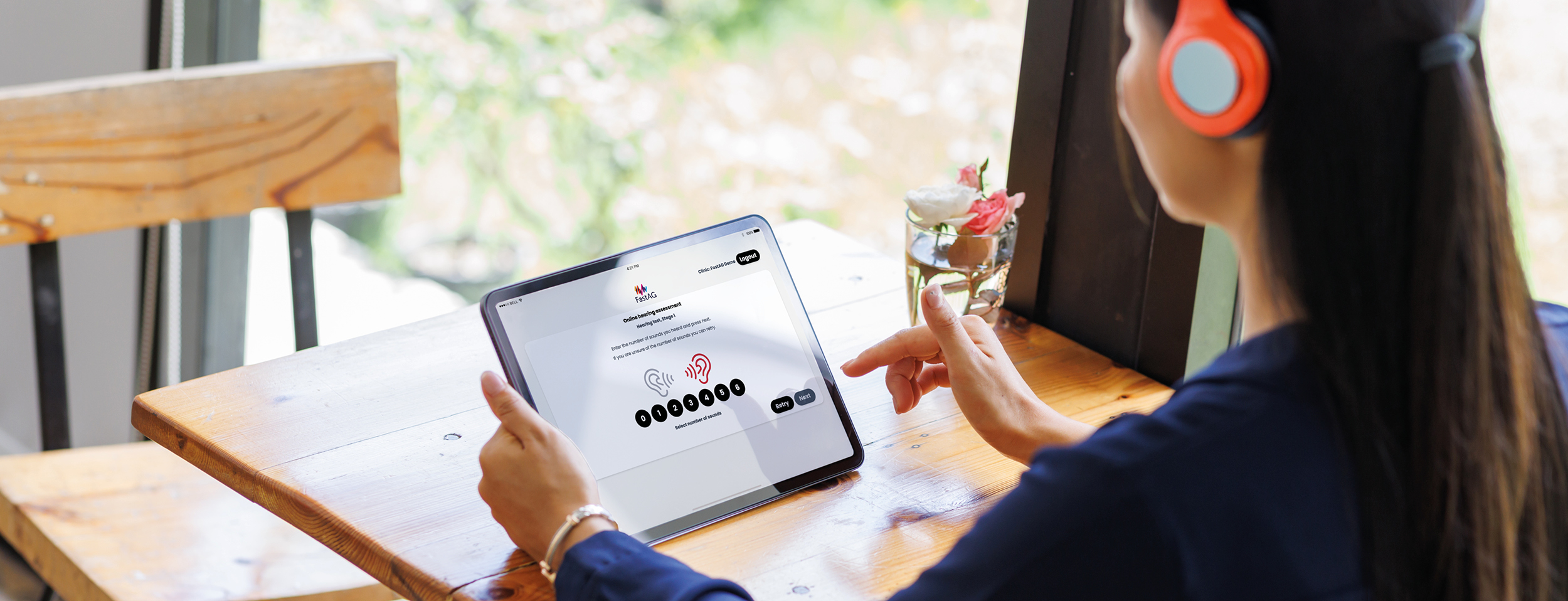 woman_with headphones_holding tablet